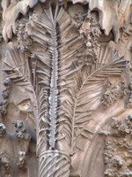 Temple of Sagrada Familia, Nativity façade, palmtree below sculptures of trumpeting angels